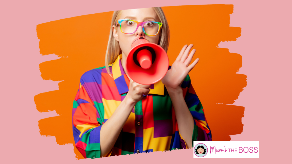 A colourfully dressed woman with a megaphone
